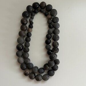 Necklace of Black and Gray Beads of Various sizes on a black cord